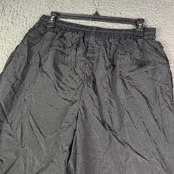 Vintage Reebok Track Pants Mens L Black Nylon Windbreaker Zip Leg Y2K Baggy - Picture 1 of 8